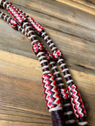 Dark cherry Romal reins with red white black zigzag leather beads on twine