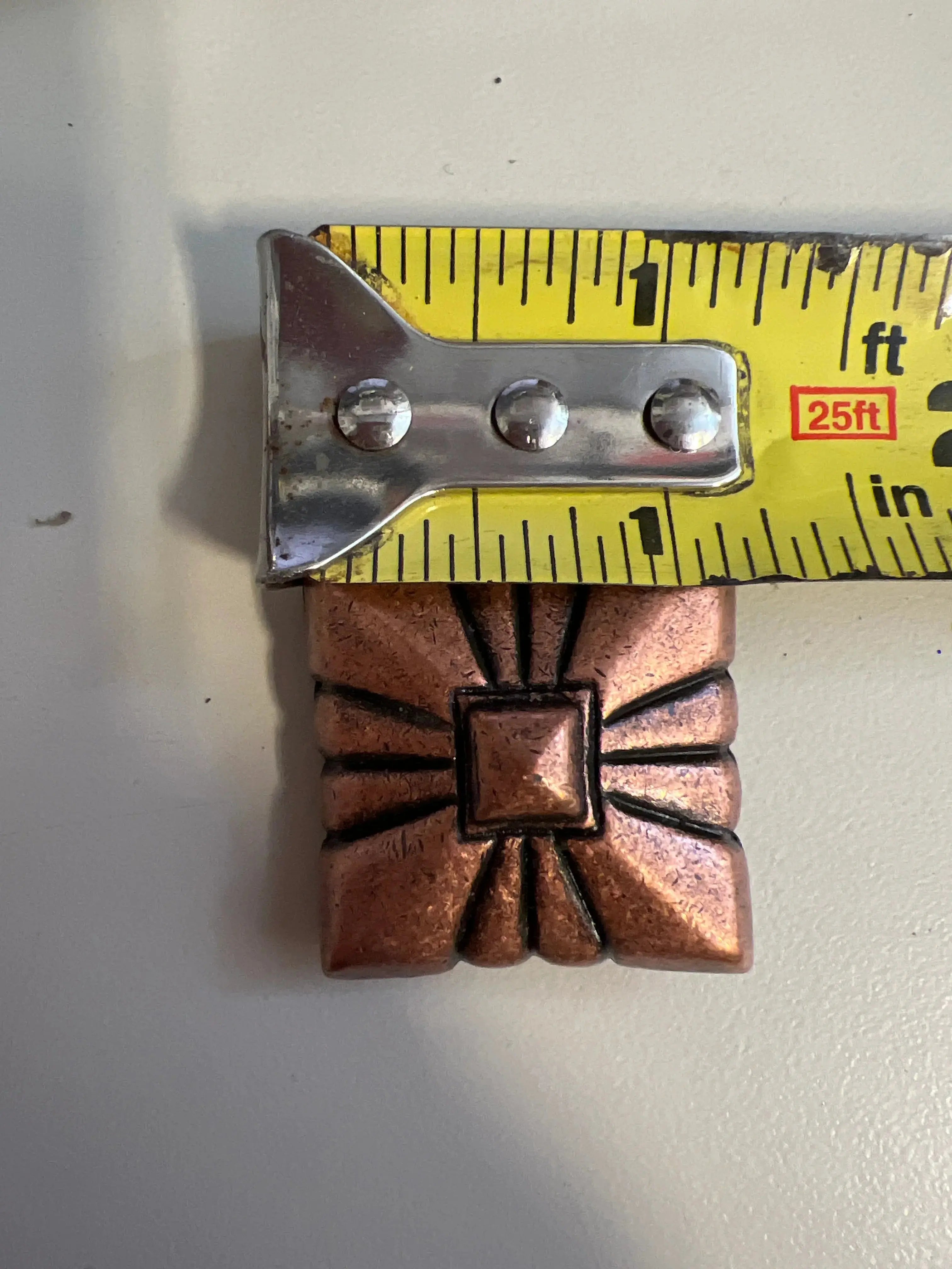 Copper pyramid embossed shape concho