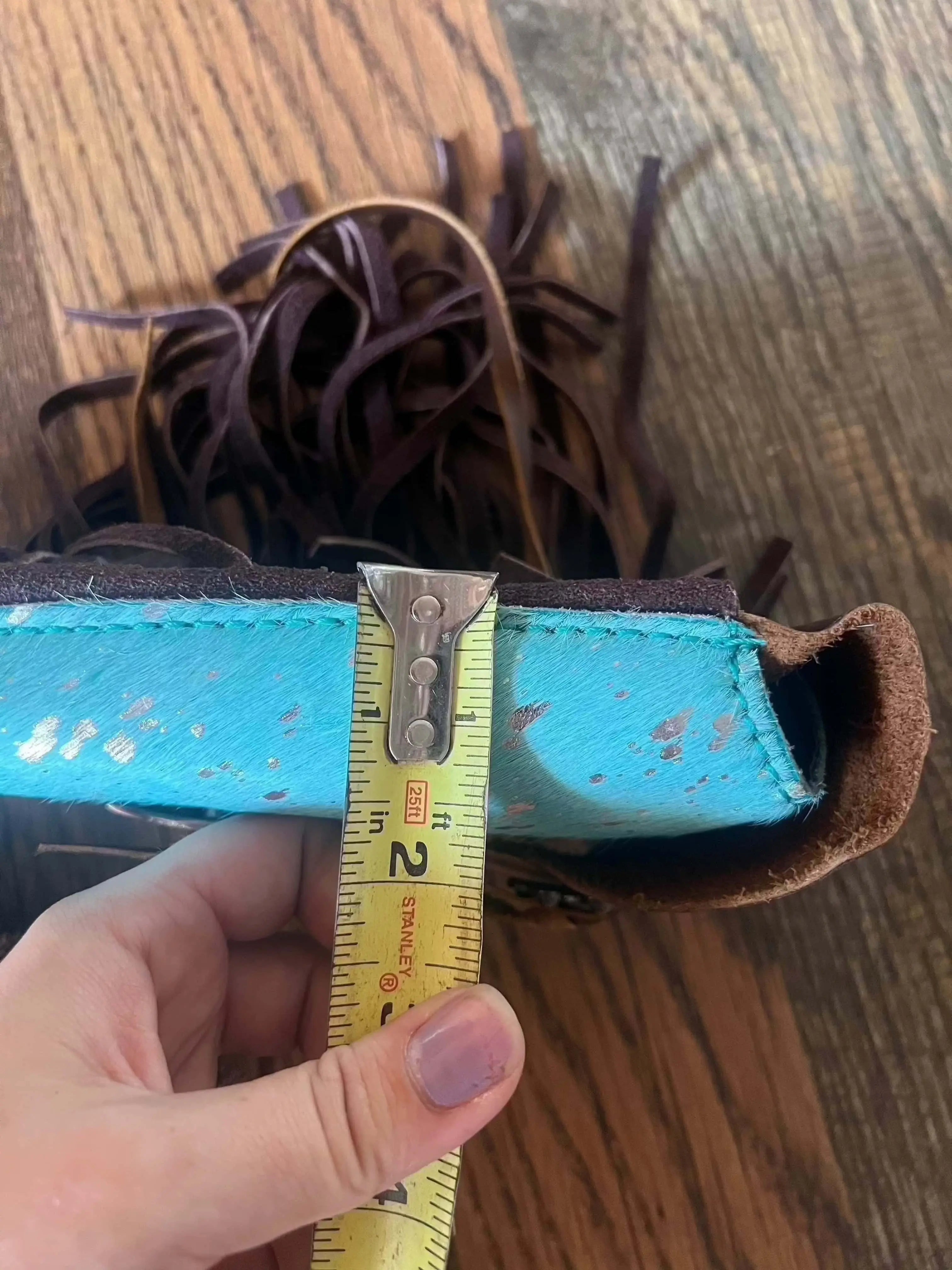 Turquoise brown leather wallet with fringed detailing on Acid Wash Teal saddle bag rear cinch