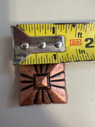 Copper pyramid embossed shape concho
