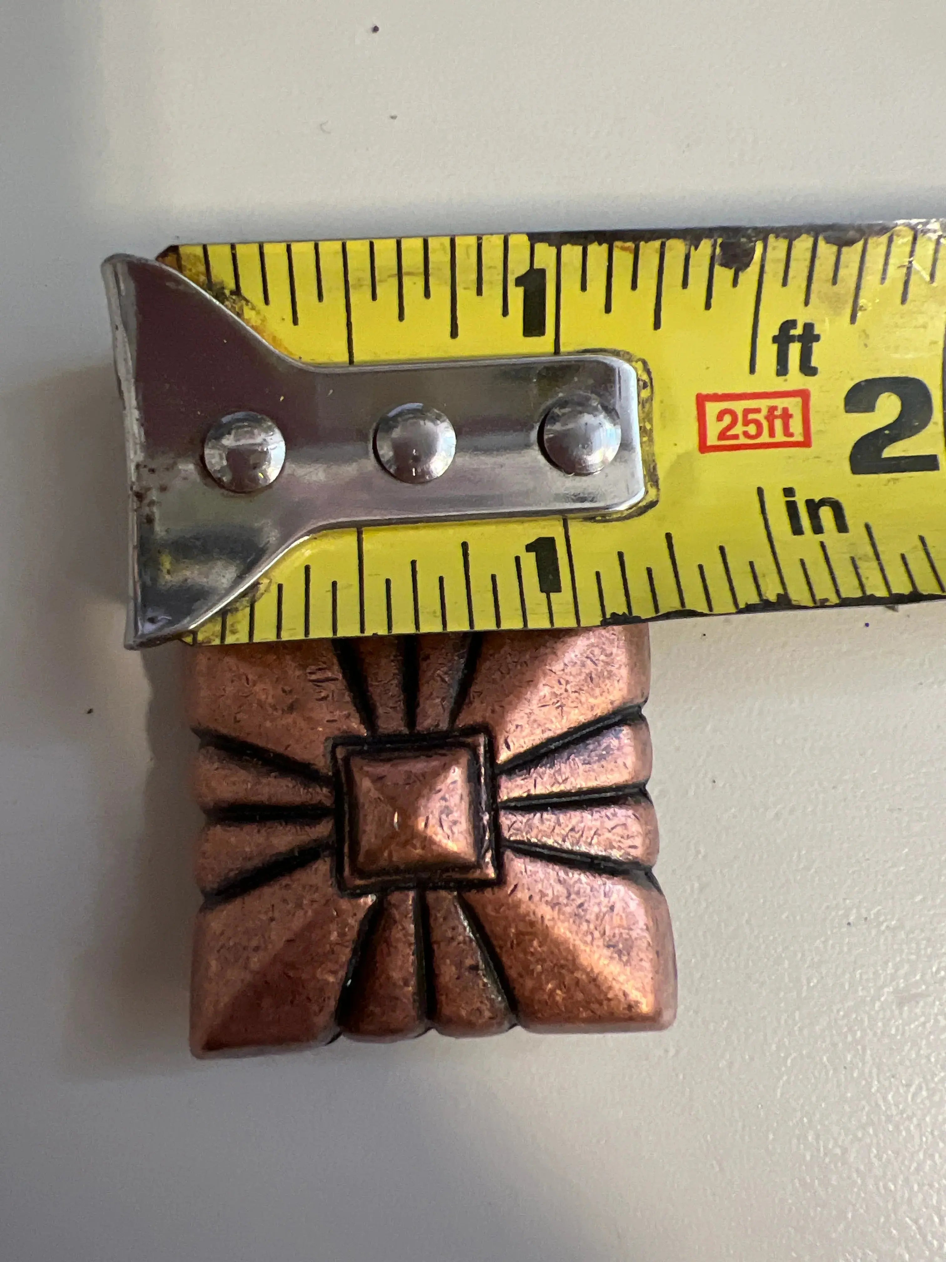 Copper pyramid embossed shape concho