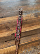 Brown leather horse halter with pink beaded trim and silver buckle