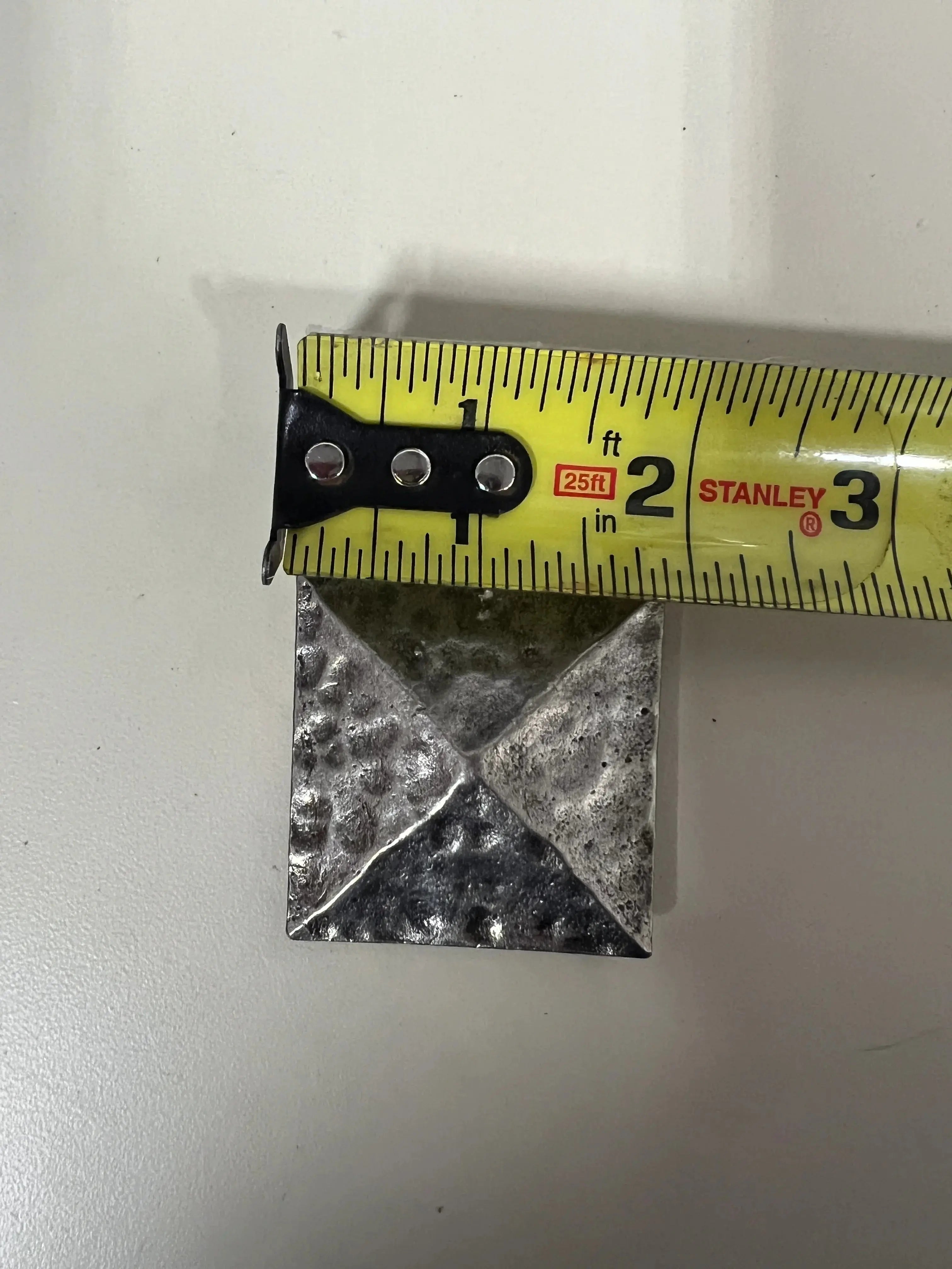 Silver pyramid shape concho with Screw.