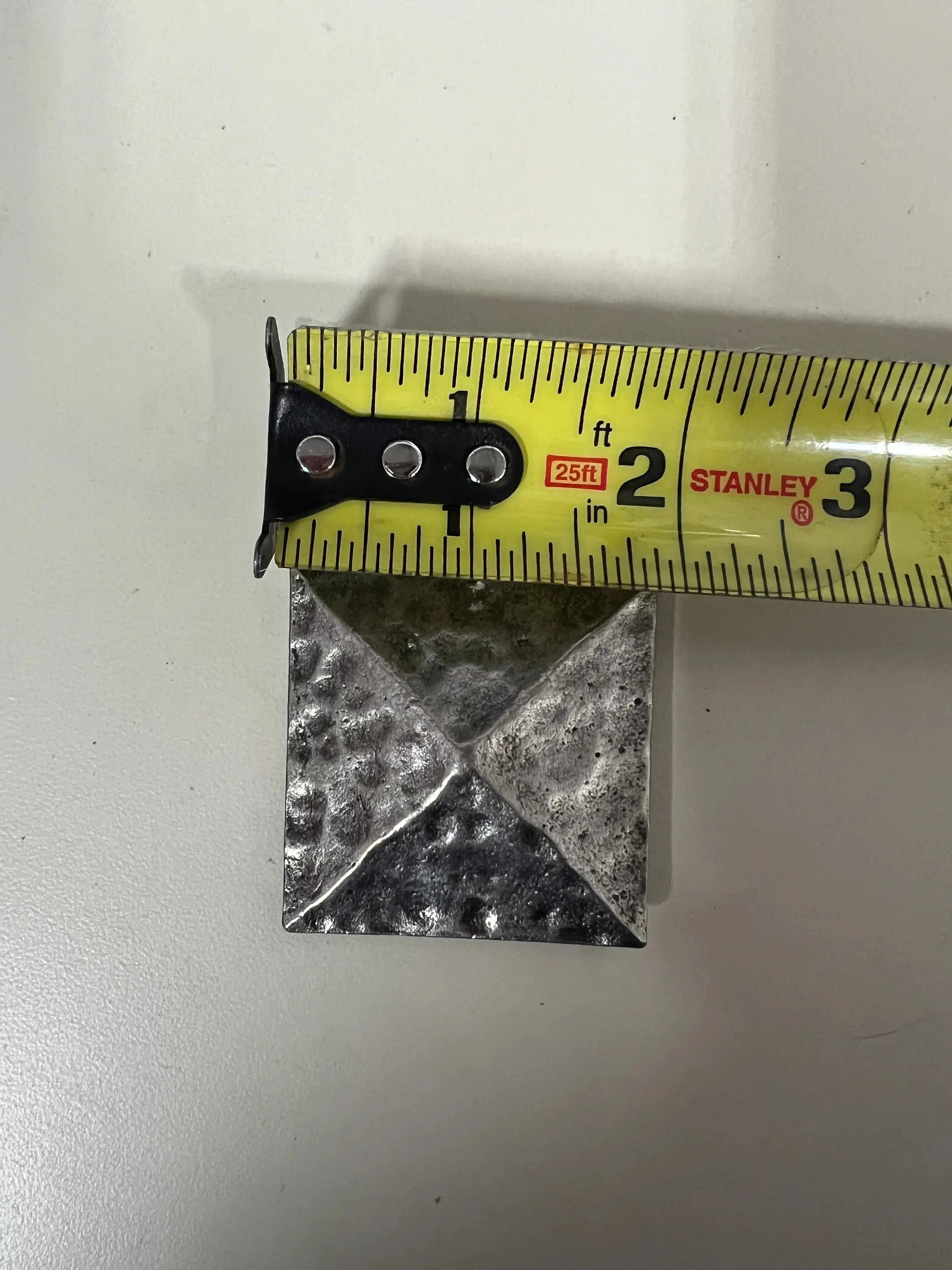 Silver pyramid shape concho with Screw.