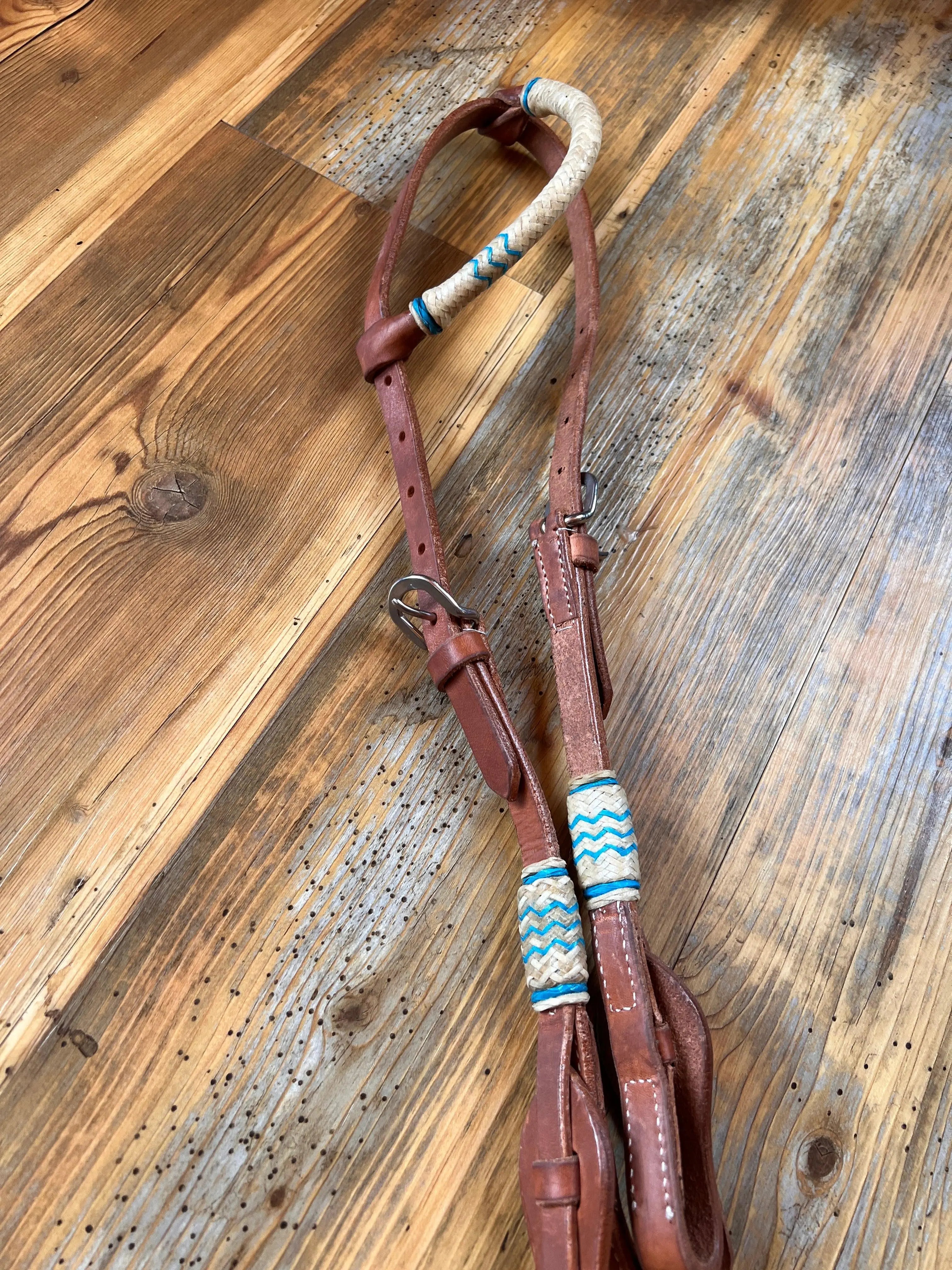 Brown Argentina cow leather one ear headstall with teal rawhide accents