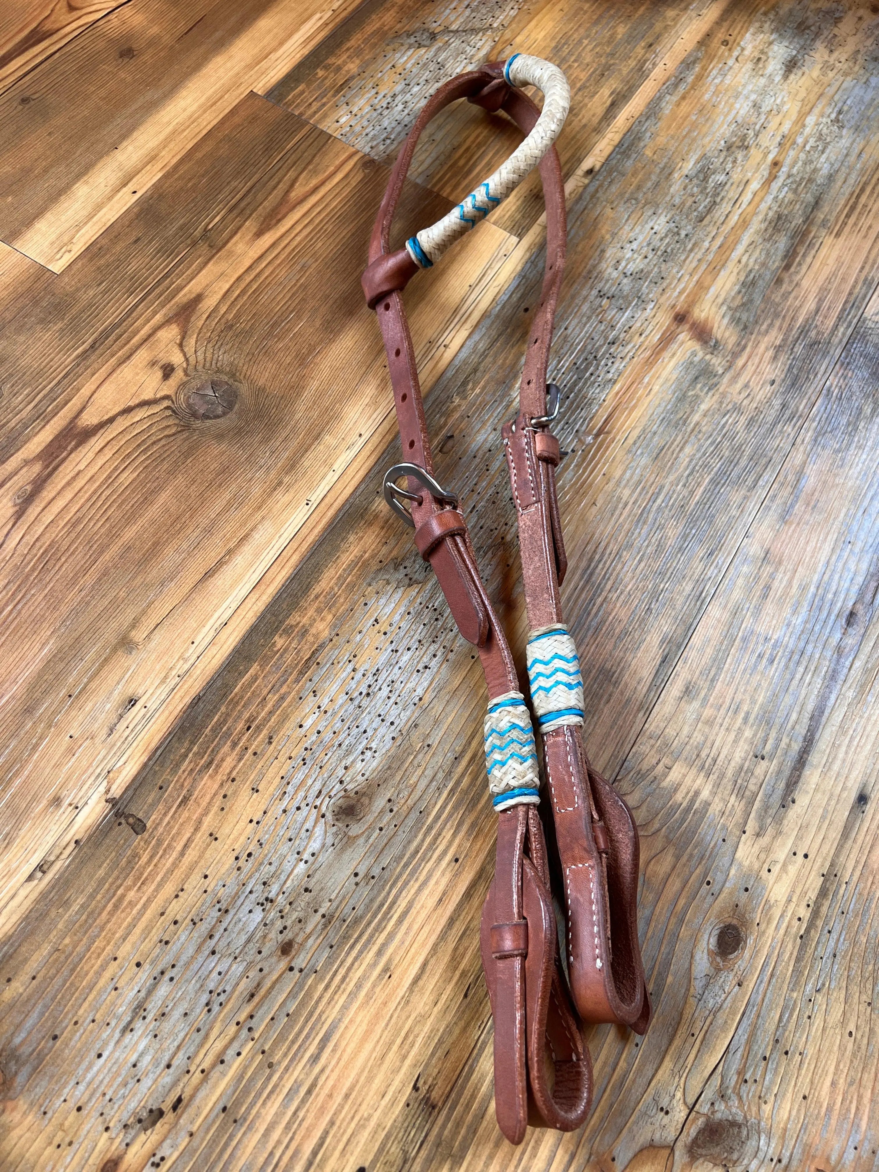 Brown Argentina cow leather one ear headstall with teal rawhide accents