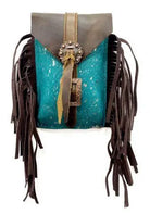Back of acid wash teal turquoise cowhide saddle bag with brown fringe buckle