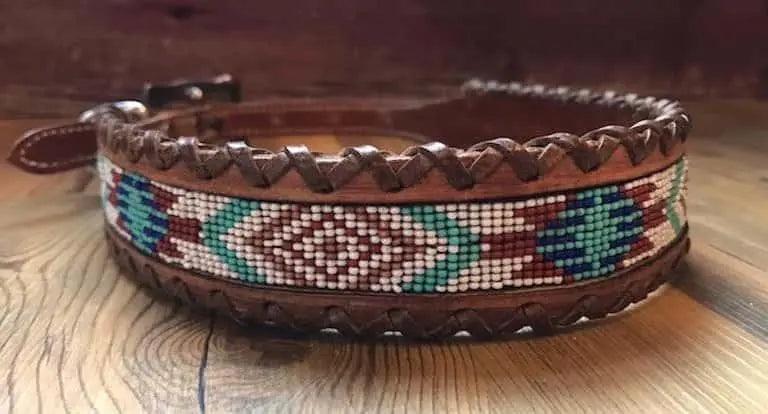 Genuine leather dog collar with white, teal, and burgundy southwest beaded inlay designa leather wrapped edge and copper hardware. Dog