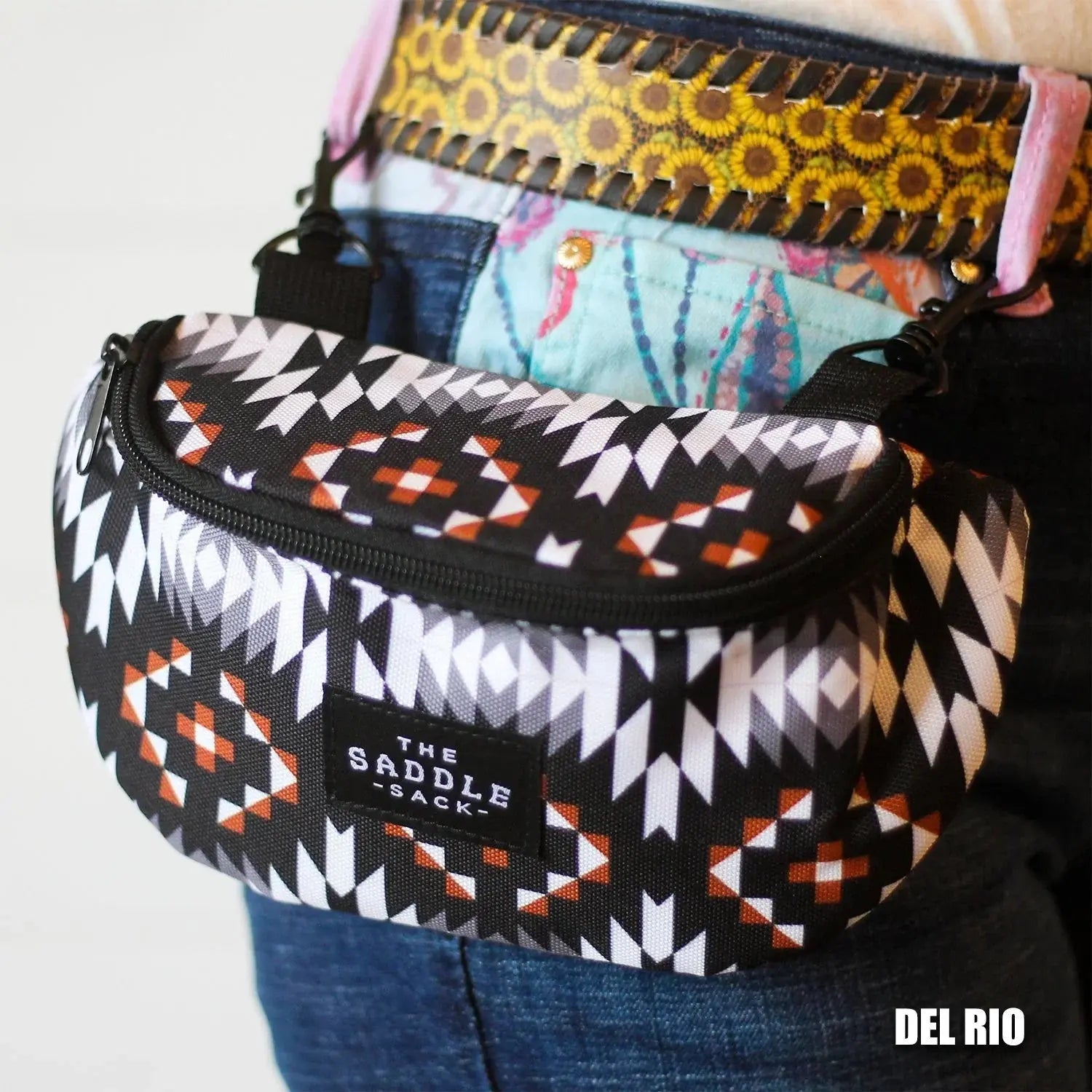 DEL RIO The Saddle Sack pet treat pouch with geometric pattern, clipped to belt.