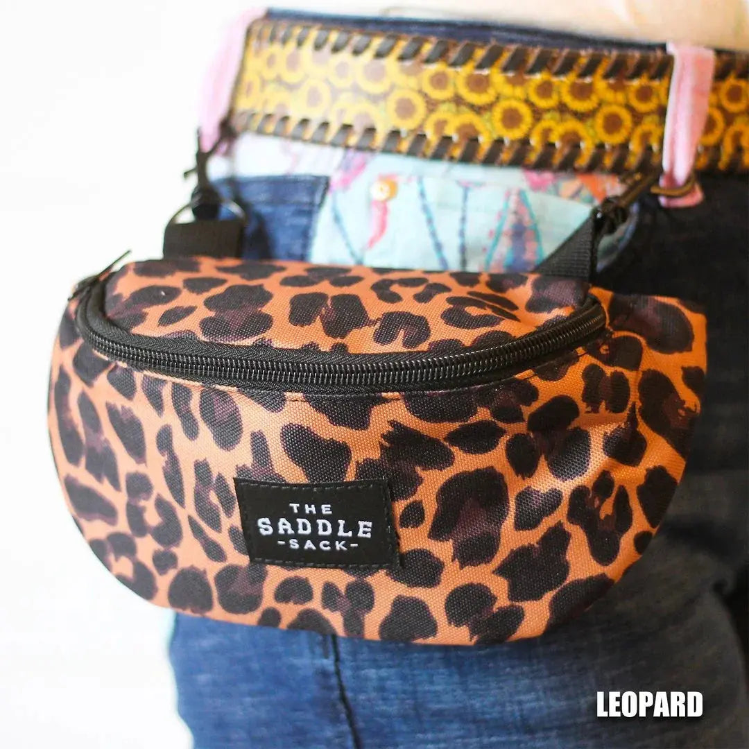 Leopard print The Saddle Sack waist bag with zipper, attached to belt on jeans