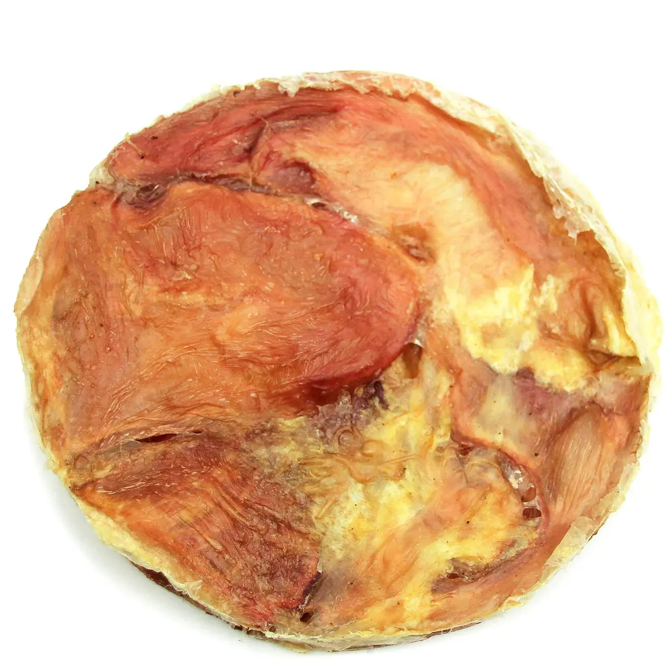 Tremenda Disc Chews: circular textured dried meat with marbled red-brown hues