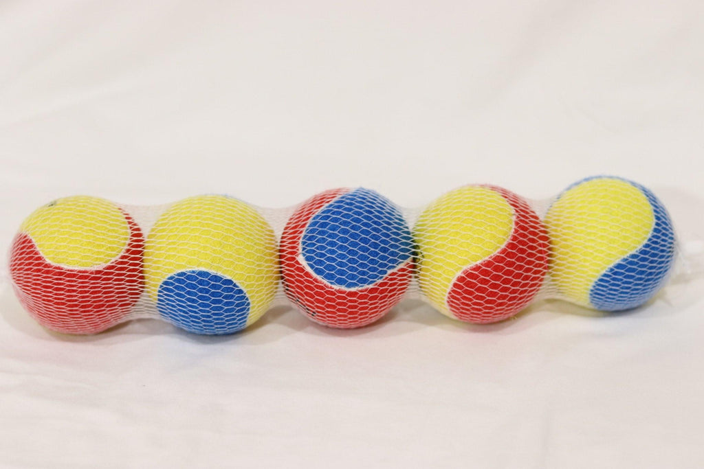 a bunch of different colored balls on a table 