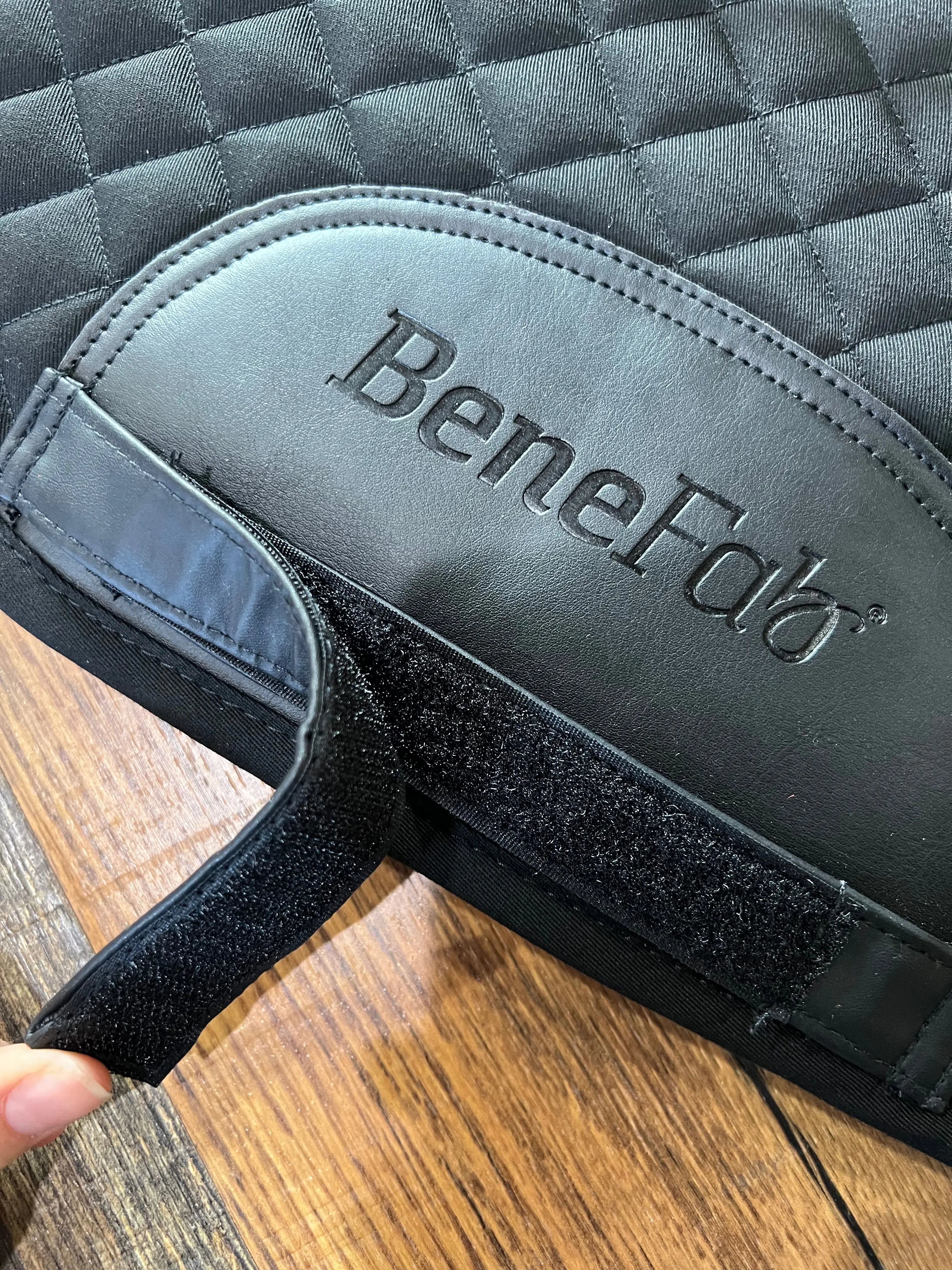 New black Benefab therapeutic quilted saddle pad with logo and Velcro strap