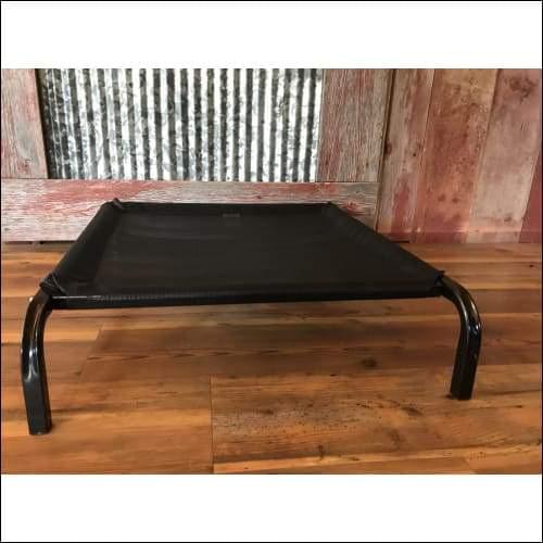 a black suitcase sitting on a wooden bench 